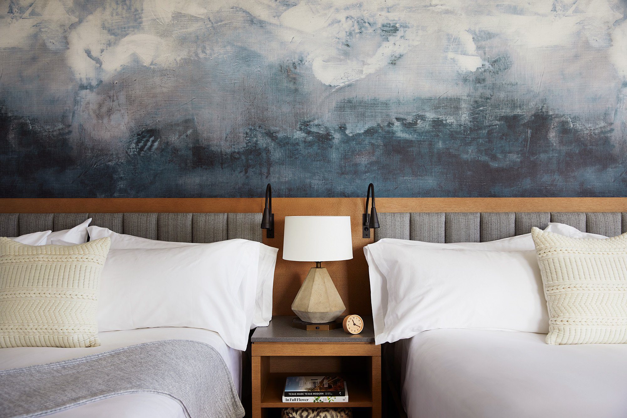 two beds separated by a side table